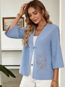 A women's fashionable blue background floral embroidery Chinese style loose button shirt, suitable for commuting to work, shopping and outdoor activities, indoor and outdoor dressing