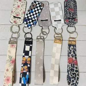 Keychain wristlet with lip balm holder