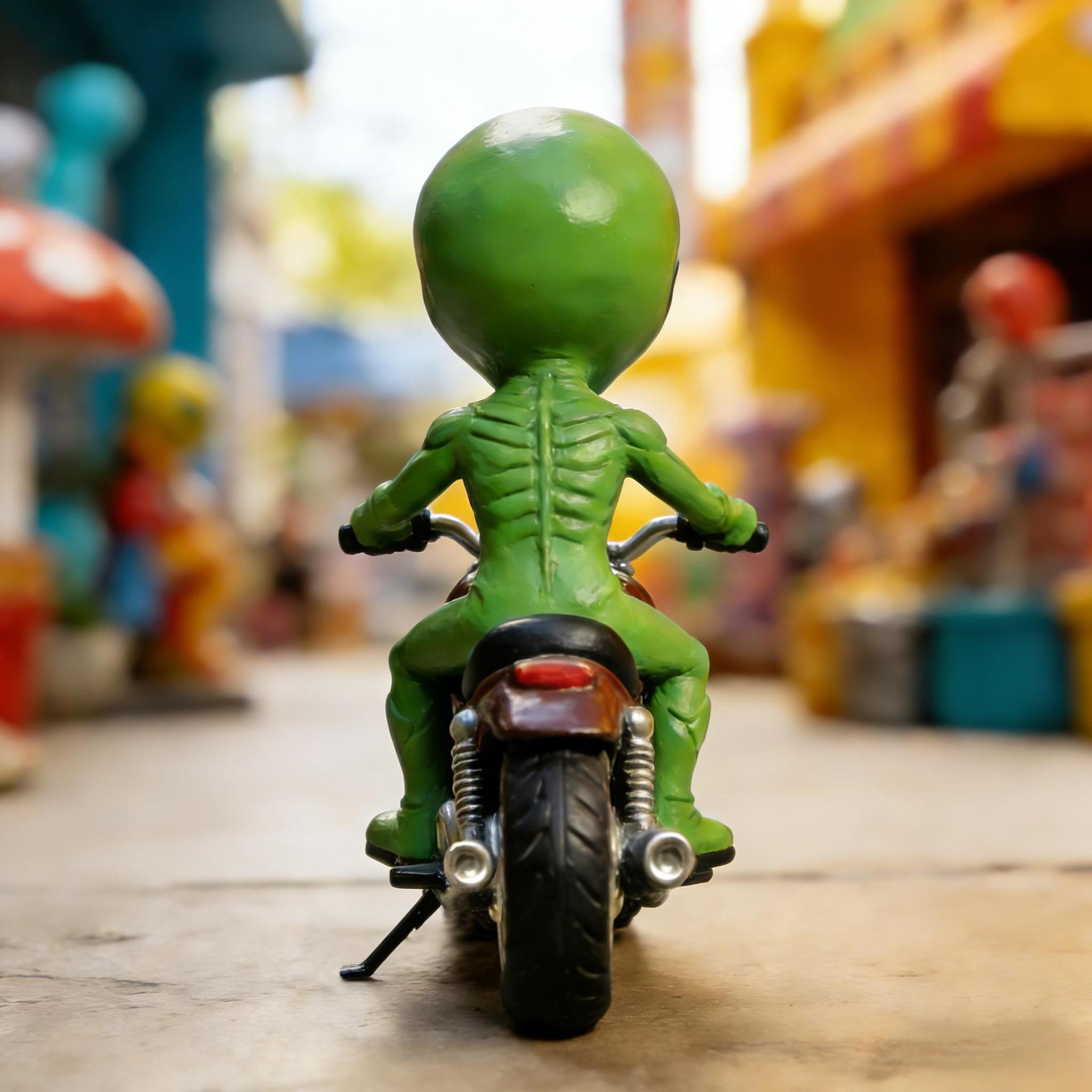 Funny alien riding a model statue, space decoration, for desktop or bookshelf display, ideal gift for sci-fi fans, cute alien design, ornament, funny home decor, art statue, sculptural tabletop decoration