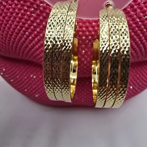 Gold-Toned Textured Bangle Set - 4-Piece Stackable Bracelets for Women - Elegant Fashion Accessory