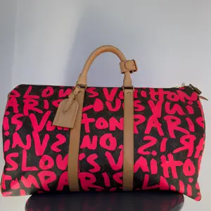 Pre-owned canvas Luggage Accessories Louis Vuitton Stephen Sprouse Monogram Graffiti Keepall 50 Fuchsia