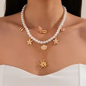 3PCS Women Teens Boho Beach Multi-Layer Necklace, Gold Plated Alloy with Faux Pearl, Cowrie Shell, Starfish & Sunburst Charms, Layered Chain for Summer Vacation, Festival & Daily, Ideal Beach Wedding/Birthday Gift