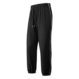 Lightweight quick-dry striped joggers, loose fit, bold side stripe detail—ideal for streetwear, casual outings, and everyday style