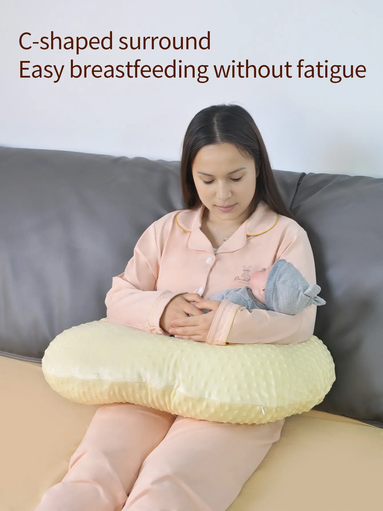 A yellow plush nursing pillow that offers comfortable support and is convenient for breastfeeding. It is machine - washable        14+