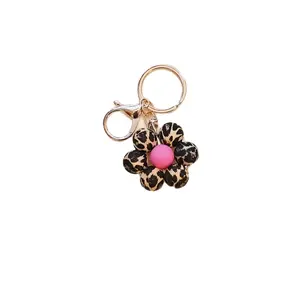 Leopard Print Flower Keychain. Made from 15MM silicone beads with a gold keychain and clasp.