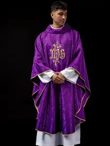 Purple chasuble with embroidered IHS motif on decorative fabric