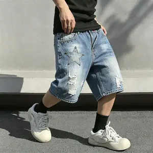 Men’s vintage distressed denim shorts with star patches and stud embellishments, American street style summer mid-thigh shorts.
