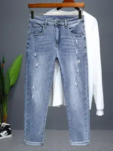 Men's Light Blue Distressed Ripped Jeans, Elastic Slim Fit Mid Waist Design, Casual Street Style, Washed Vintage Look, Button Closure