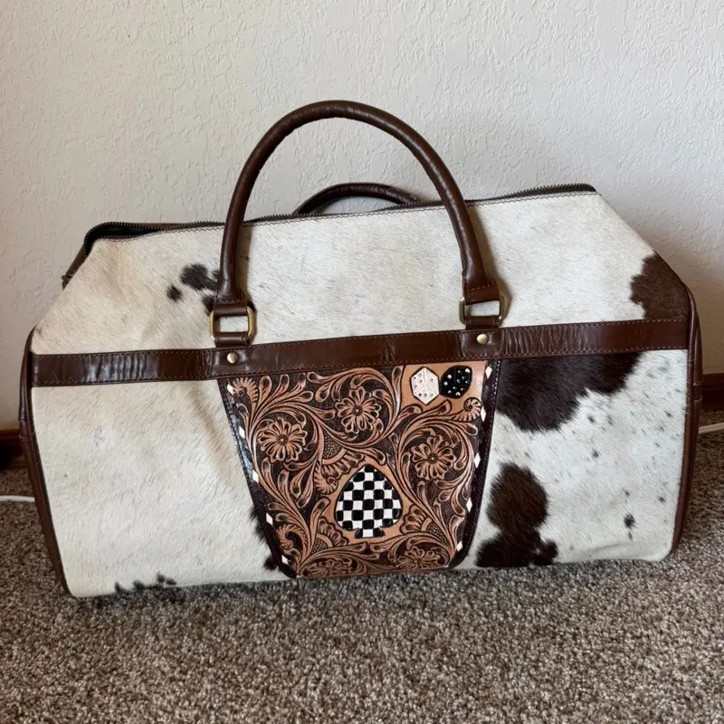 Duffle bag with cowhide and spade and dice design