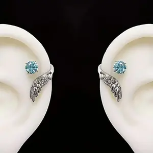 A pair of stunning angel wing ear studs for both men and women, featuring unique angel wings wrapped with synthetic zirconia - perfect for everyday wear, parties, vacations, gifts, and beach outings