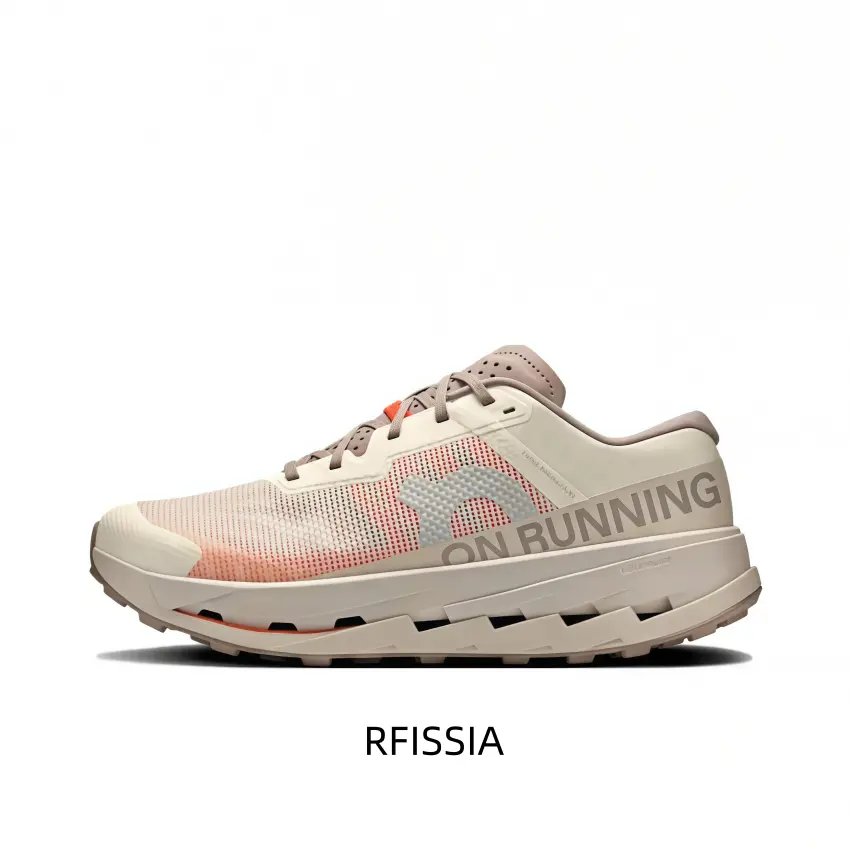 Creamy White And Pale Peach All-Terrain Running Shoe Featuring A Breathable Knit Upper, A Silver-Tone Side Typography Overlay, And A Deep Lugged Outsole