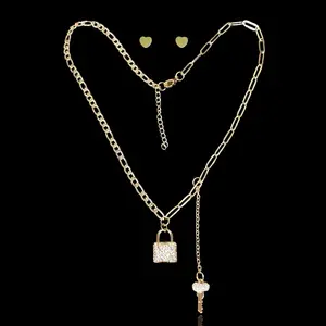 18K Gold-Filled Lock & Key Stainless Steel Set Necklace: 15.5" + 1.5" Adjustable link Color : 18k Gold Material: Stainless steel, Cubic Zirconia