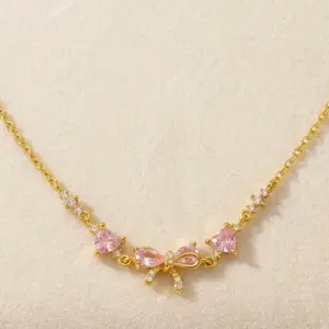 Cute Pink Bow Necklace  Sparkling Zirconia Detail | Elegant Gold Tone Chain for Daily Wear