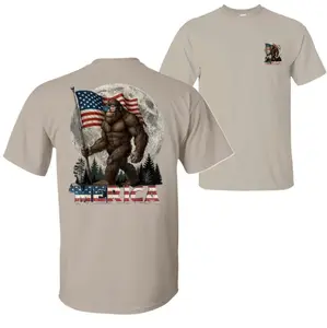 Bigfoot ’Merica T-Shirt, Patriotic Sasquatch Moon & Flag Graphic Tee, Soft Cotton Tan Shirt for Men & Women, Funny USA Pride Shirt for July 4th or Outdoor Freedom Fans