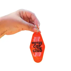 Messy Car Club Motel Keychains - Orange Design with Pink Stripes and Text
