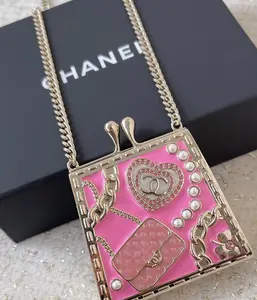 C Pink Pearl and Crystal Micro Bag Pendant Necklace Opens