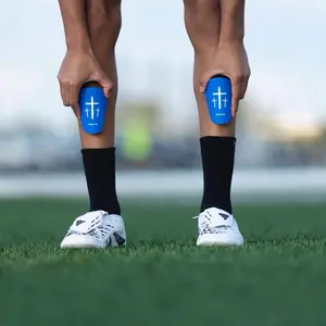 Momentum Blue Cross Shin Mini Guards 4x3in Minimalist Functional Safety Enhancing Performance Field Gear