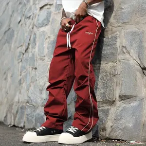 Men's Drawstring Waist Casual Loose Fit Wide Leg Pants with White Side Stripes & Embroidery Design Casual Gym Wear Sweatpants Tracksuit Sports Bottoms Athleisure Style Tracksuit Outfit Sweatpants Set Drawstring Straight Leg Workout Clothes SpringStatement