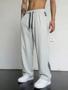 Single pack men’s ice silk quick-dry casual pants featuring side color-block panels, a drawstring elastic waistband, a drapey straight cut, breathable moisture-wicking fabric that doesn’t feel stuffy—ideal for everyday summer commuting outfits.