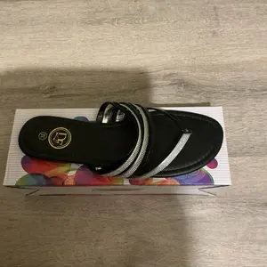 Women's Black Sandals with Silver Straps and Gold Logo - Comfortable Footwear for Everyday Wear