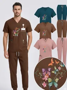 Premium Olive Green Medical Scrub Suit Set, Detailed Colorful Butterfly & Flower Design, Matching V-Neck Top & Pants, Unisex for Clinic & Lab Wear.