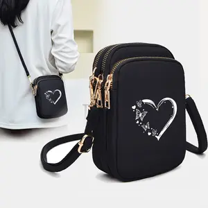 Heart-shaped window, adjustable shoulder strap Oxford bag - lightweight daily travel and work backpack, butterfly heart print texture phone wallet, black single-shoulder bag for teenagers, featuring a coin pocket and headphone jack