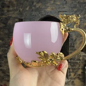 Handmade master cup with inlaid golden dragon handle and pink jade glass