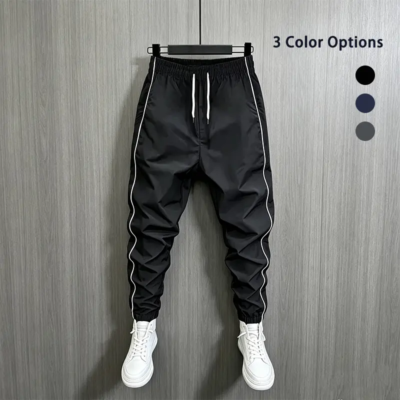 Men’s fashion casual jogger sweatpants with side stripes and a simple design, featuring an adjustable drawstring waistband; elastic cuffs, suitable for sports fitness and everyday wear—sporty casual long pants, men’s apparel bottoms.