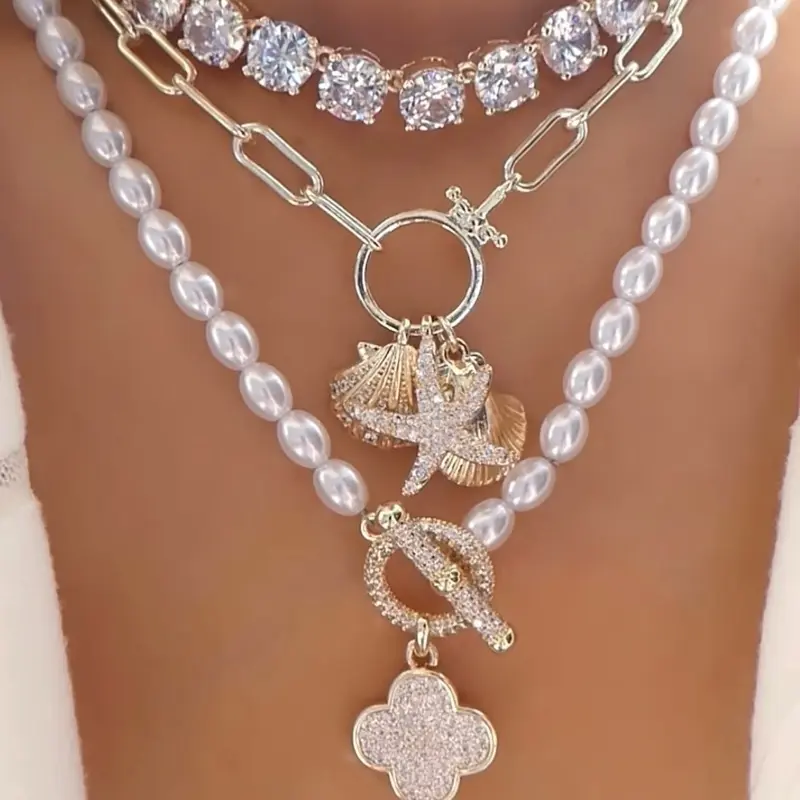 Shop The Look - 14k Gold Plated Starfish and Seashell Charm Necklace, 14k Gold Plated Cluster CZ Necklace and Pearl Pave Clover Toggle Necklace