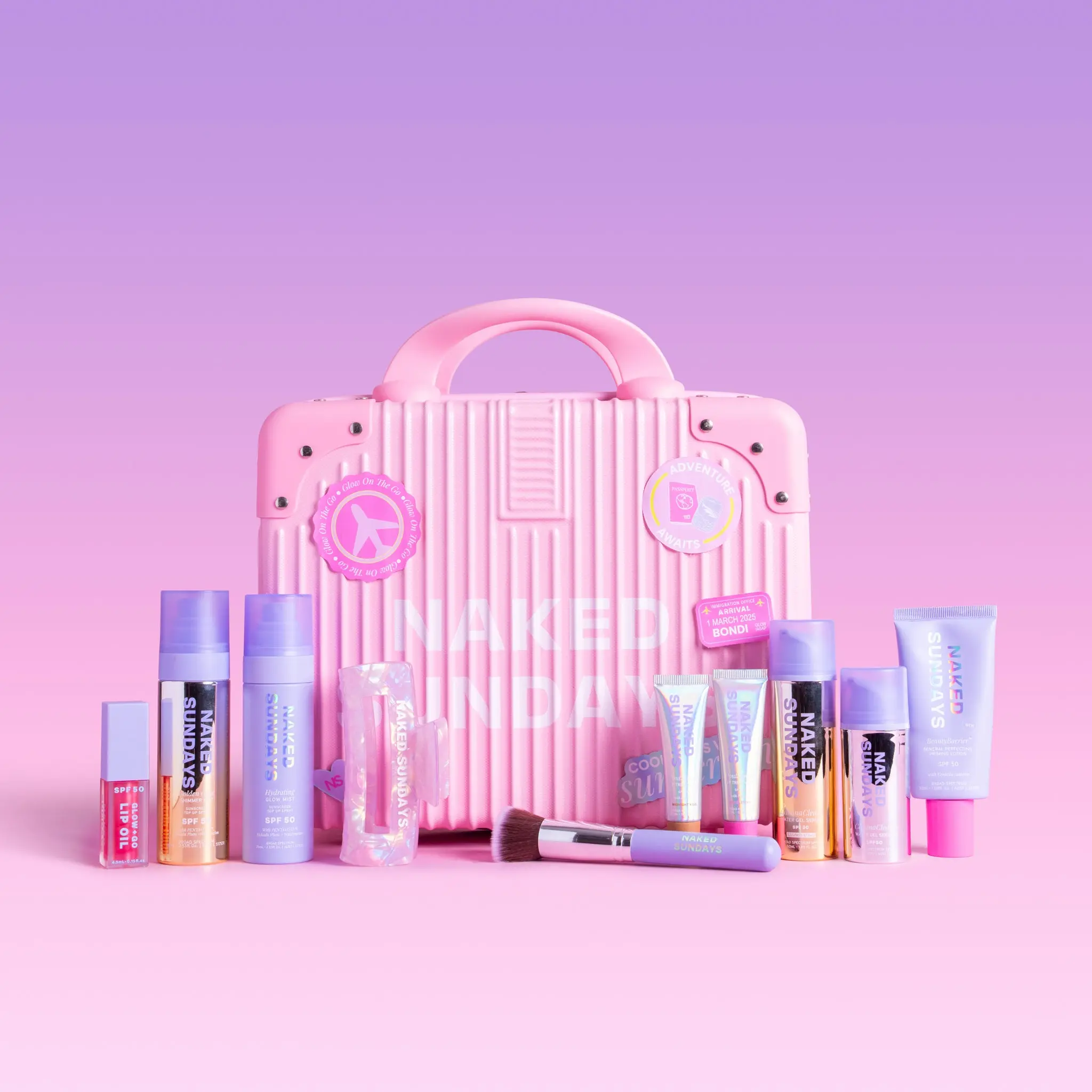 First Class Jetsetter Beauty Bundle Kit - Mini Exclusive Pink or Lilac Suitcase plus Naked Sundays bestselling SPF and Skincare products  (SAVE 40%)