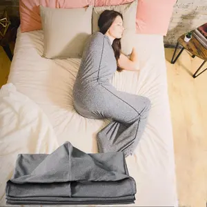 A gray wearable sleeping bag, Sleep Sack - rectangular sleeping equipment, suitable for camping trips, indoor napping, and sofa rest, is an ideal choice for outdoor enthusiasts and those seeking family comfort