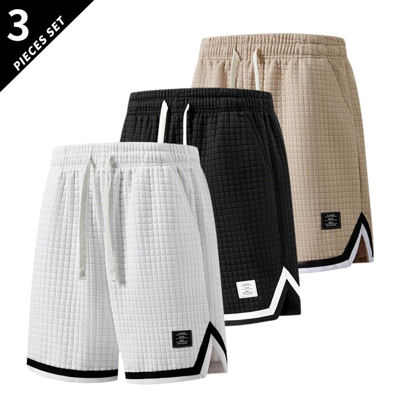 3-pack men’s breathable waffle basketball shorts with an elastic drawstring waist, side pockets, contrast piping, and a split hem—ideal for the gym, running, training, and everyday wear.