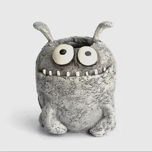 Orbit Mini Blobhouse Planter: Goofy gray mini monster for succulents or air plants.