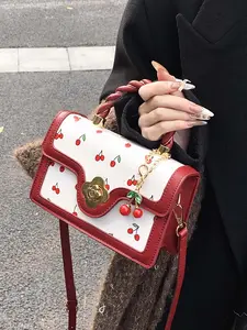 Sweet cherry print handbag, woven handle metal pendant retro small square bag, small, stylish, exquisite and cute, can be used handbag  crossbody, versatile and available in multiple colors, suitable for daily commuting, shopping, etc. Pu Leather Handbag