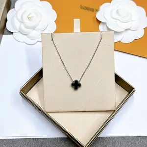 Elegant four-leaf clover pendant necklace, white gold plated, adjustable design, sparkling and sophisticated jewelry for women.