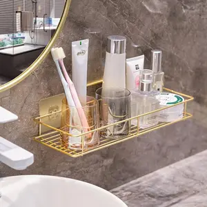 Gold-colored toothpaste, toothbrush, towel, bath towel rack, bathroom shelf, bathroom sink, toiletries storage rack