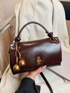 Retro fashion simple shoulder crossbody bag, gold lock braided knot handle handbag, with personalized beaded pendant, personalized lazy style casual versatile shoulder bag, Fashionable handbag, suitable for daily commuting, shopping and dating, etc.