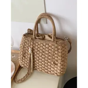 woven tote bag with dual carrying options (handheld or crossbody), featuring delicate fringe ornaments, lightweight yet practical design with spacious capacity, travel enthusiasts