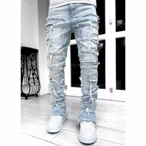 Men’s white stretched patchwork tassel distressed full-length stacked jeans — fashionable denim hip-hop pants made from soft fabric for everyday wear and easy styling
