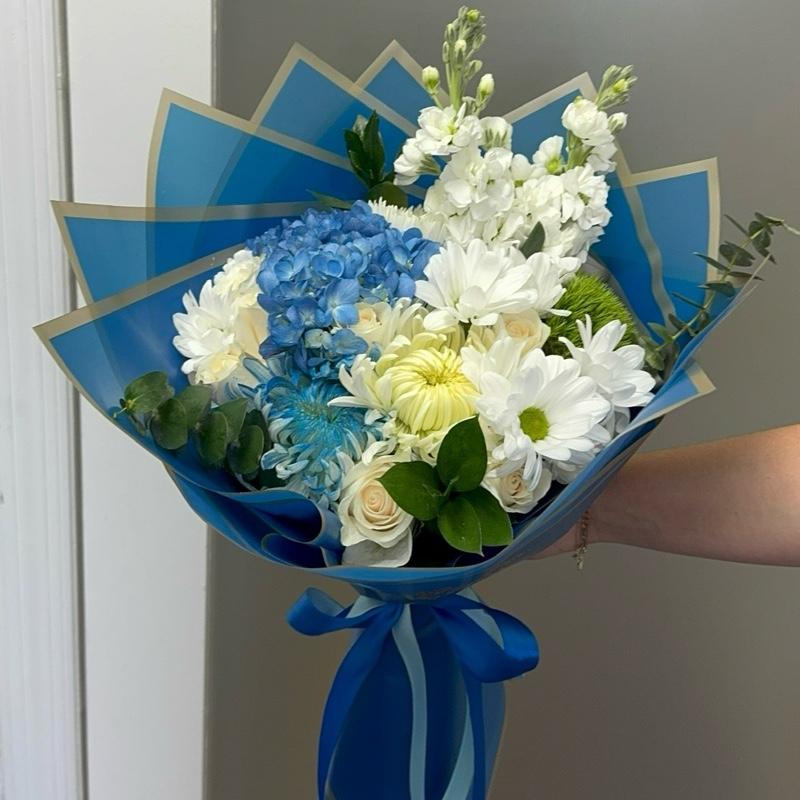 Blue Ocean Bouquet with Blue Hydrangeas White Chrysanthemums and Greenery in Blue Packaging