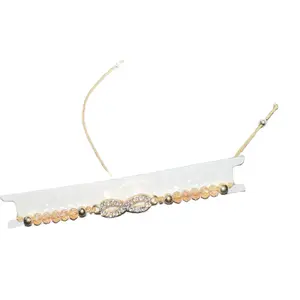 Gold String Beaded Infinity Bracelet with Gold Cord and Decorative Beads