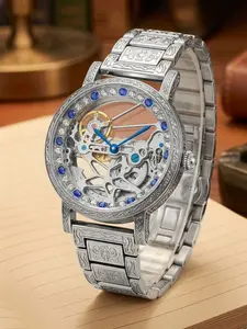 A men's vintage luxury openwork movement silver engraved automatic mechanical wristwatch