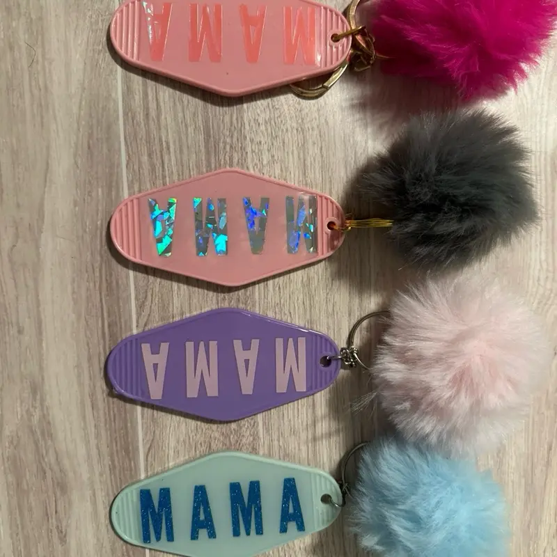 Mama motel Keychains - Assorted Colorful Keychain Designs with "MAMA" Text and Soft Pom Pom