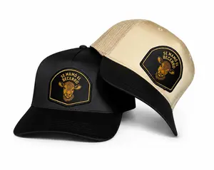 El Becerro Norteño Patch Hat - Black Trucker Cap with Embroidered Cow Design and "SE MAMÓ EL BECERO" Text
