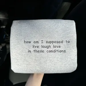 "How am I supposed to live laugh love in these conditions" Embroidered Sweatshirt