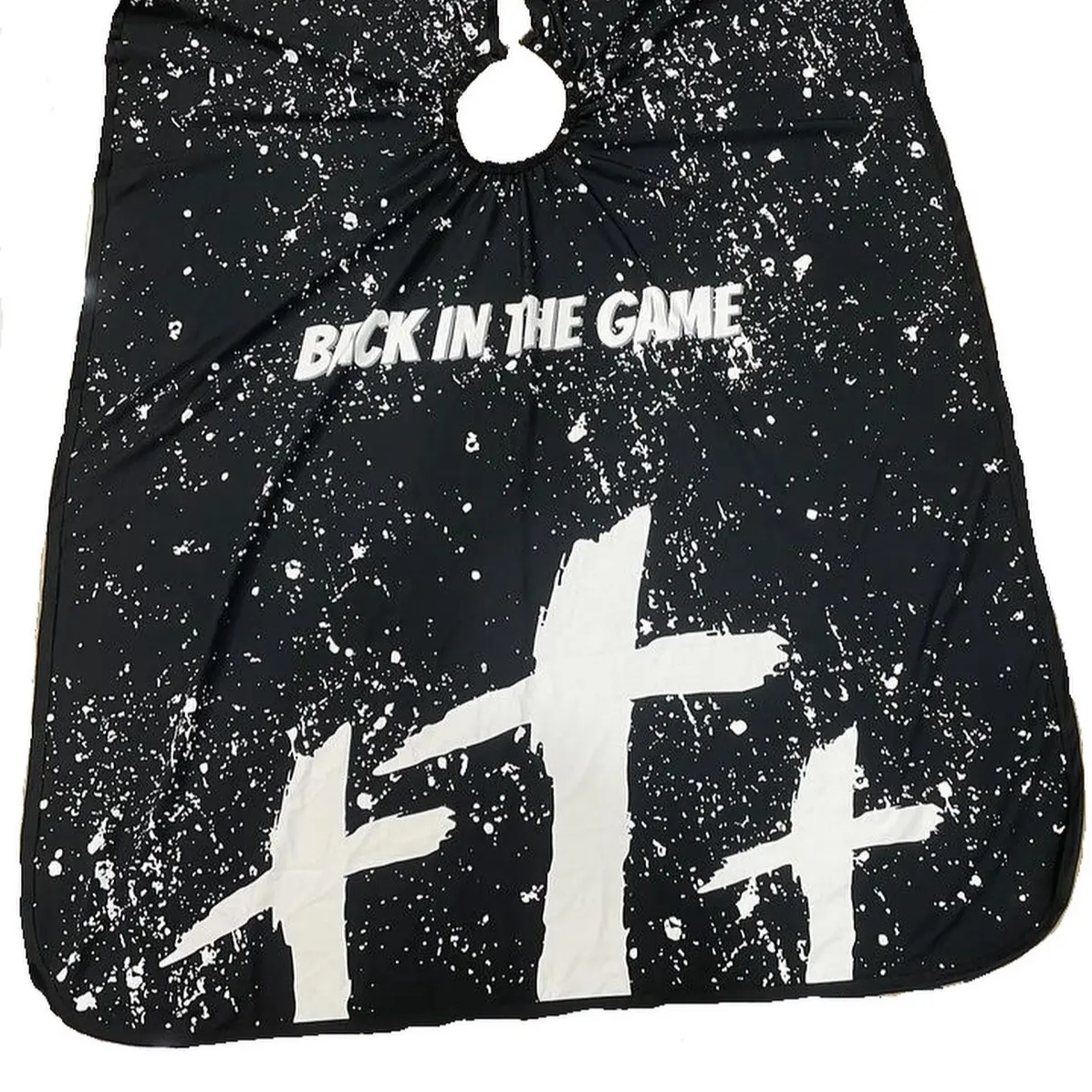 Blessings Barber Cape by Back In The Game. Durable, Hair styling cape for use in BarberShop or at home. Lightweight polyester, adjustable clips and secure buttons for MAXIMUM comfort.