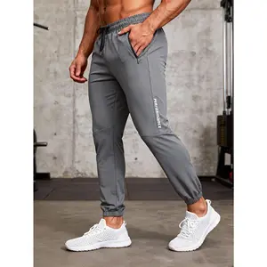 Men's lightweight breathable drawstring zipper pocket ankle binding sports sweatpants Multi color optional loose fit fitness running casual ankle pants Side letter printed versatile casual sports pants for daily commuting