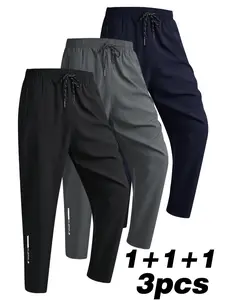 Set of 3 casual athletic pants featuring zippered pockets, an elastic waistband, and a regular fit, suitable for school, the gym, running activities, and outdoor wear.
