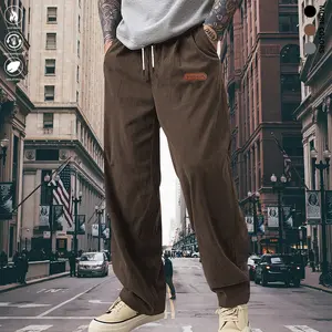 men's casual pants featuring a simple and versatile style with drawstring design, adding a casual feel. The pants have delicate small details, making them full of texture. The loose fit provides comfortable and relaxed wear, suitable for everyday outi