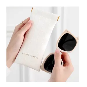 Checkered glasses case for women — portable spring-frame sunglasses pouch with automatic closure, pressure-resistant and anti-crush design.